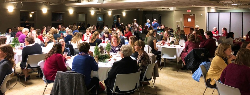 Women of University Reformed Church gathered at tables in fellowship